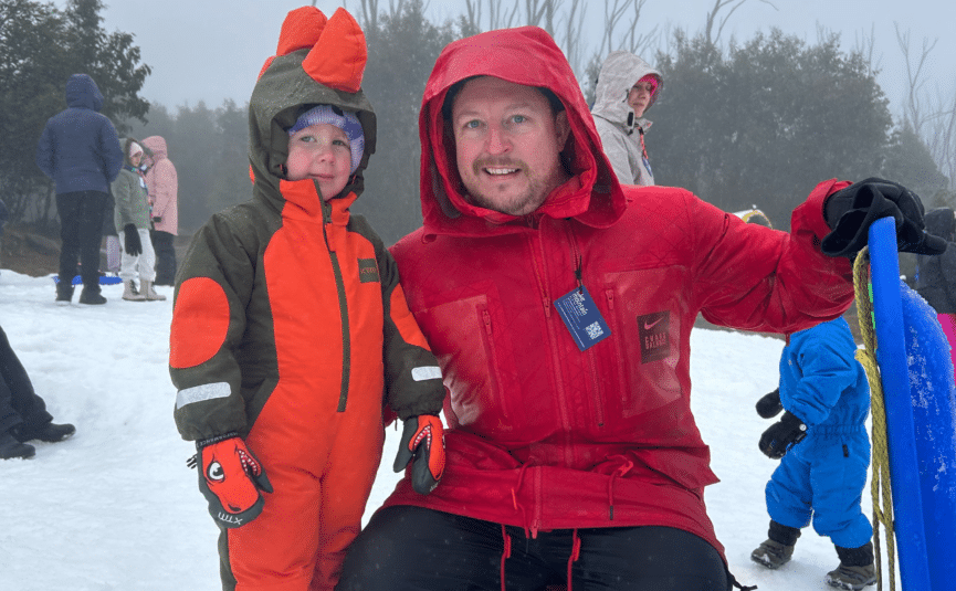 father and son in the snow