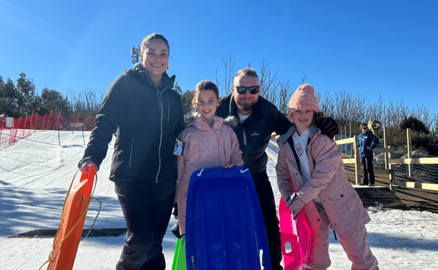 family with toboggans