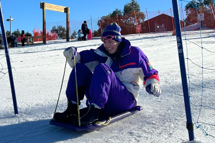 woman tobogganing