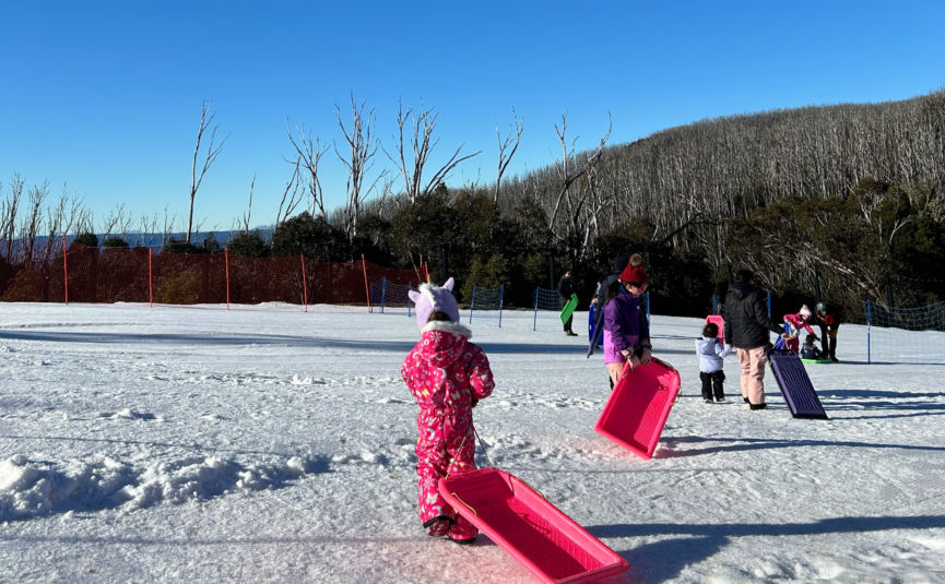 girl pulling toboggan